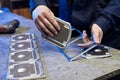 ÃÂ¡raftsman disassembles aluminum blanks of metal profile. Steel industry. Cutting aluminium billet